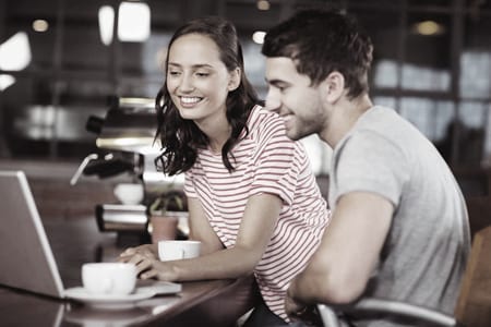 Man and woman with cycles socialising about Google+, Twitter, and Facebook at a course in Singapore.